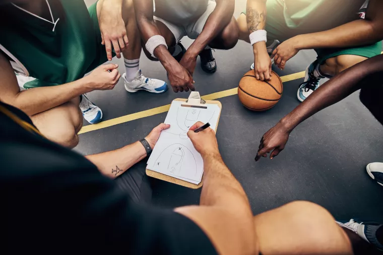 Photo: Coach and players planning match